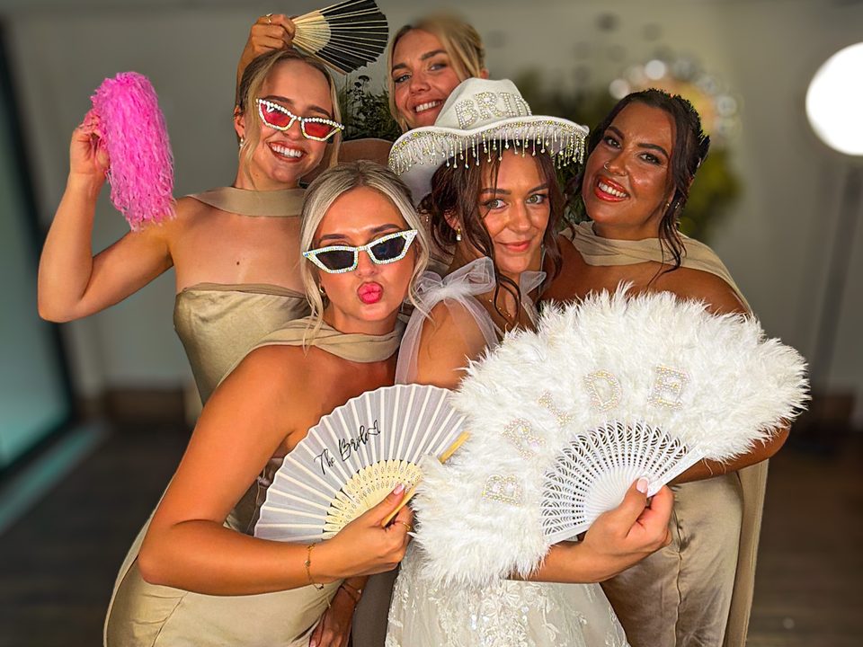 Bride and bridesmaids on the Party Octopus 360 photo booth at The Grand Lodge at Oaklands