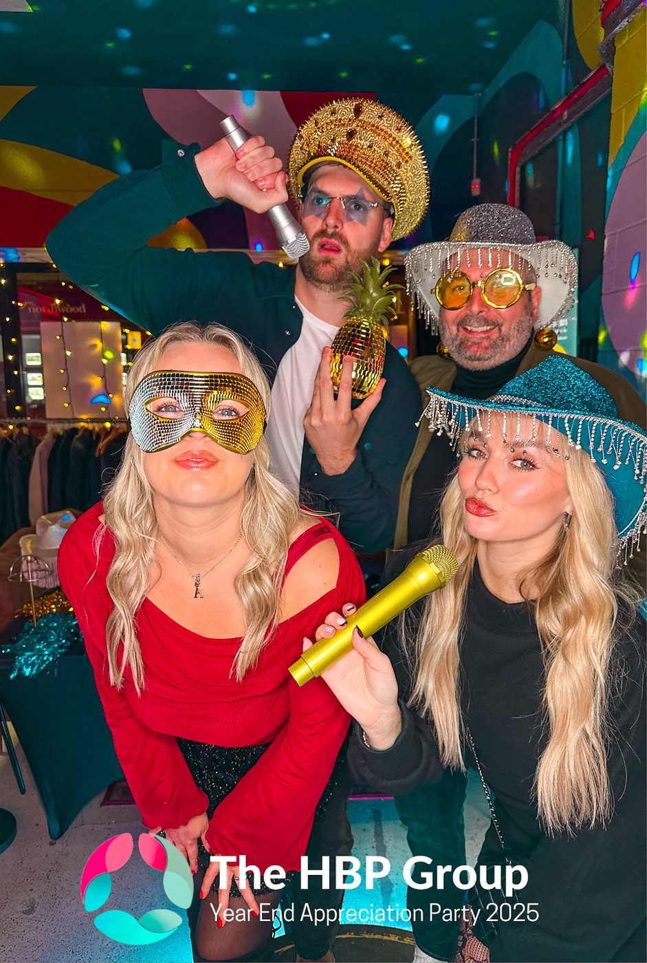 Colleagues with premium props at a 360 photo booth at The HBP Group staff appreciation party