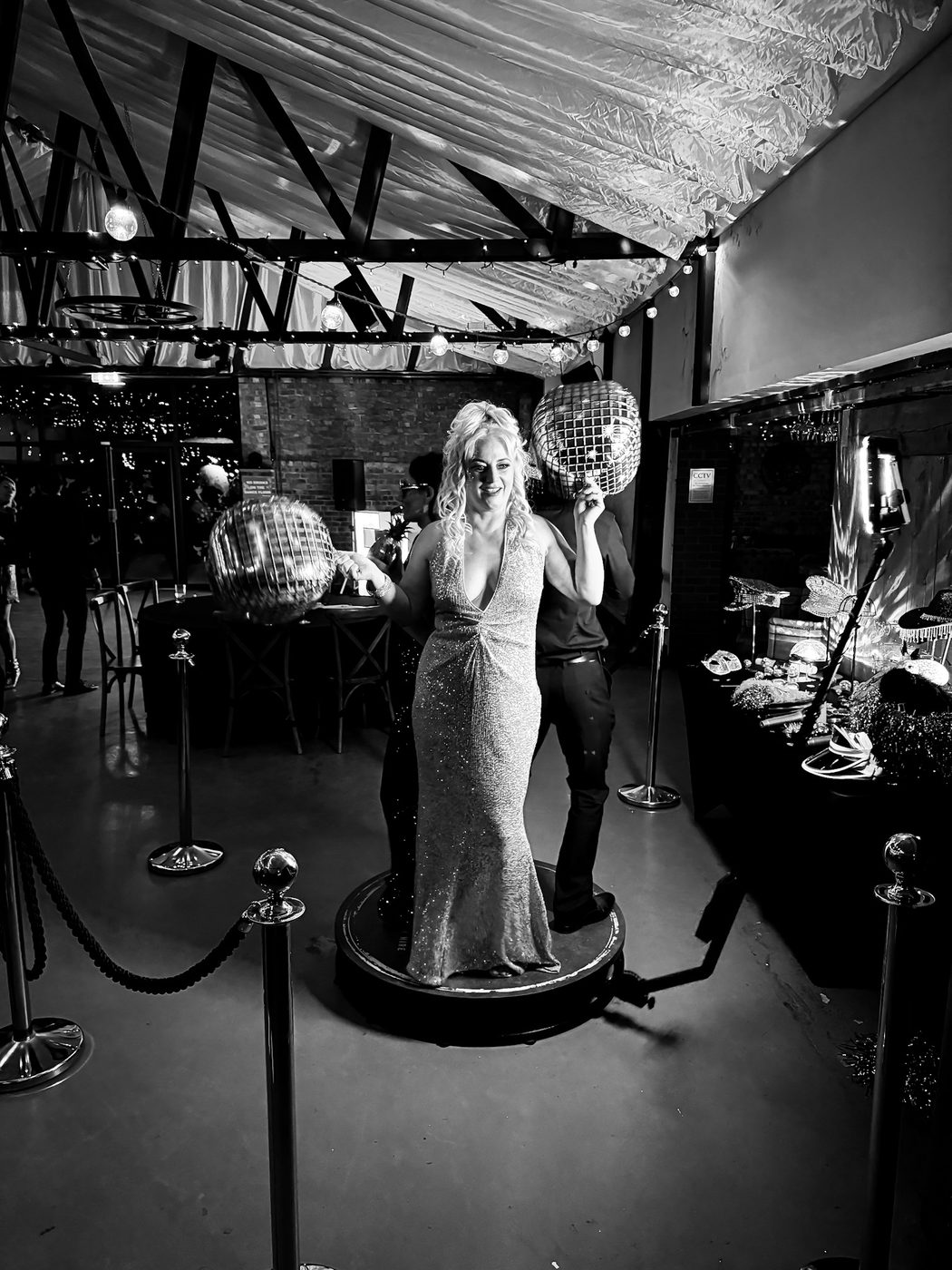 Guest on the 360 photo booth platform at a private celebration at The Beverley Barn