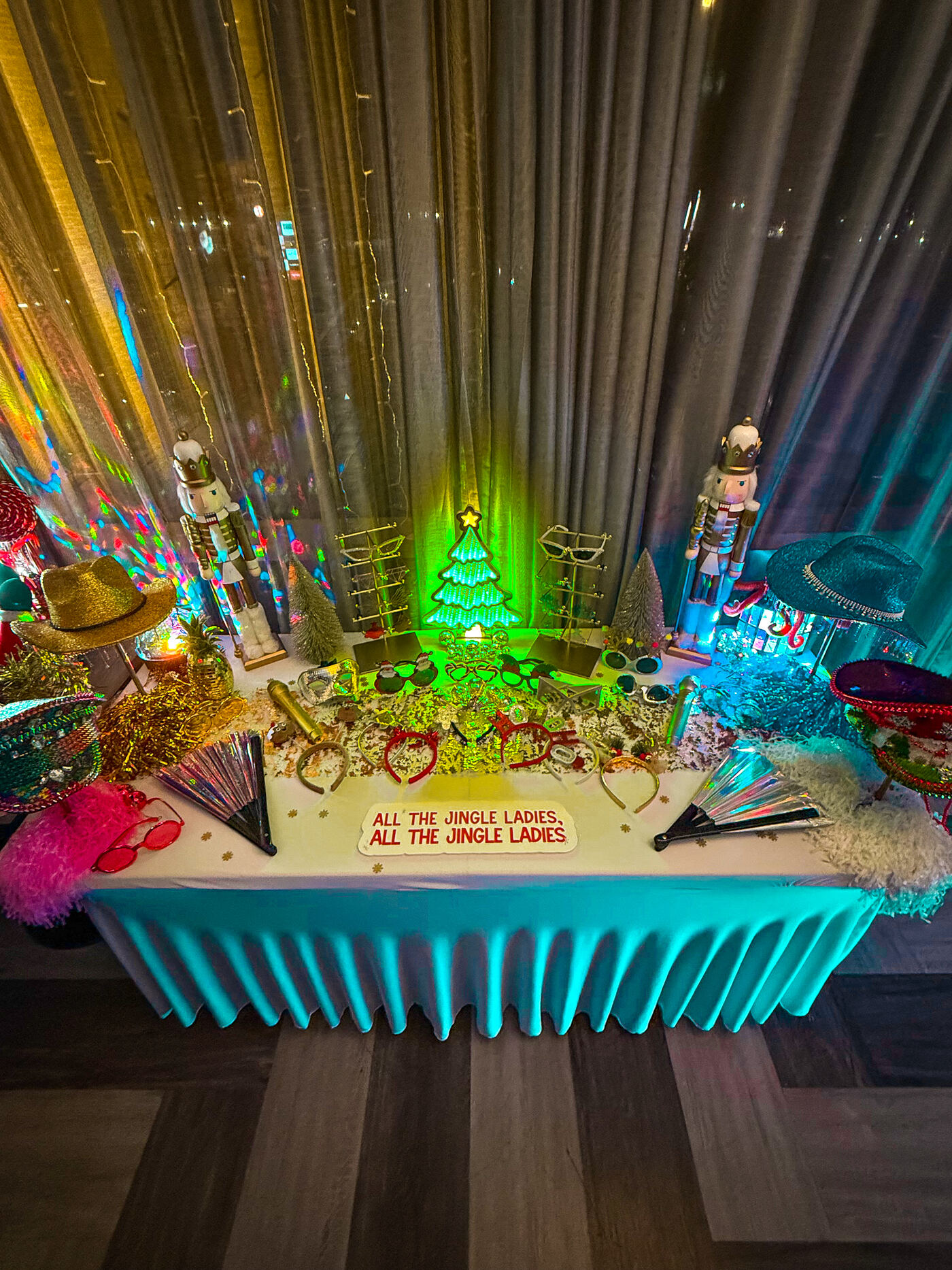 The Party Octopus styled Christmas prop table with nutcrackers, a light-up tree, disco baubles and festive glasses